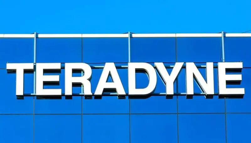 Teradyne corporate logo displayed in large white letters on a blue glass building facade