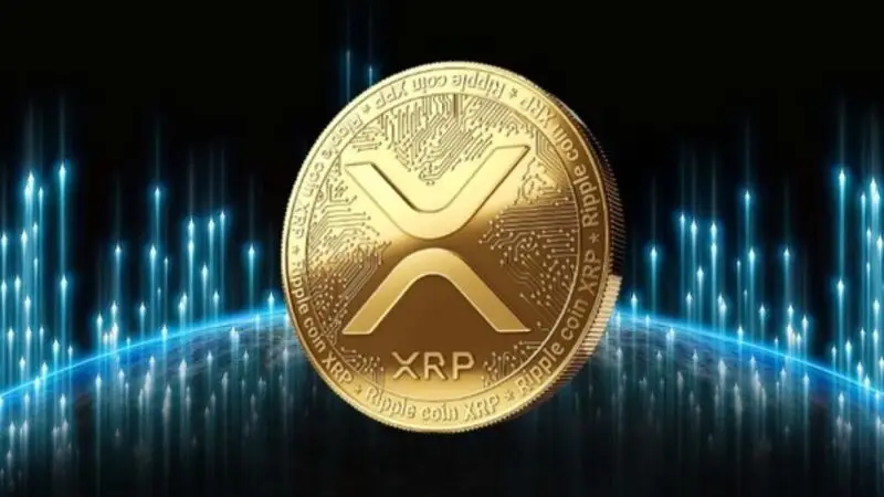 Golden XRP cryptocurrency coin displaying the distinctive 'X' symbol against a dark background with blue digital light effects, representing Ripple's digital asset