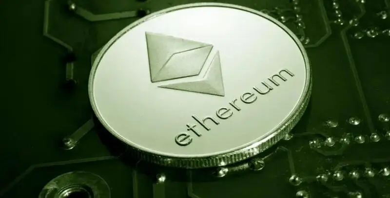  Ethereum coin on circuit board with green tint