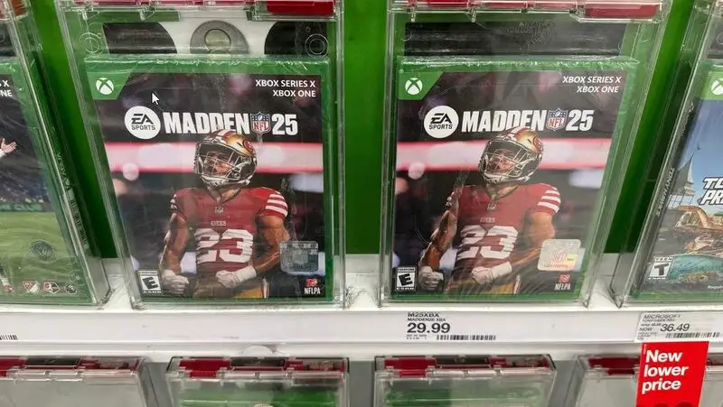 Madden NFL 25 game boxes displayed on retail shelf