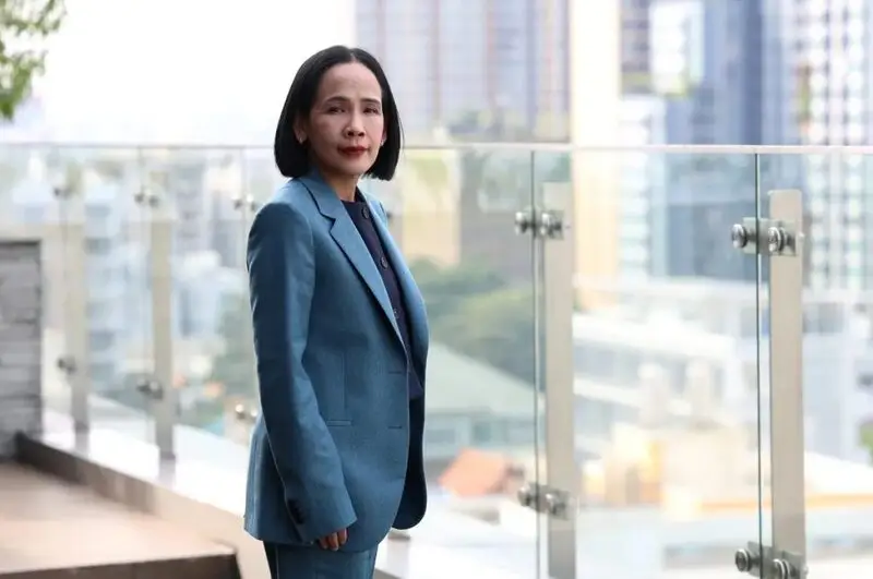 Thai SEC Secretary-General in professional office setting