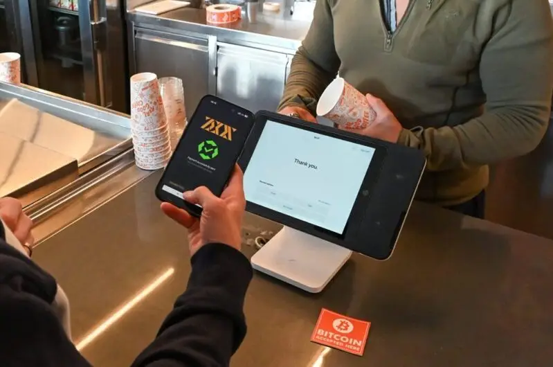 Customer using Lightning wallet to complete Bitcoin payment at Square Terminal